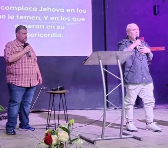 Pastor Michael Chamberlain sharing a message with an interpreter